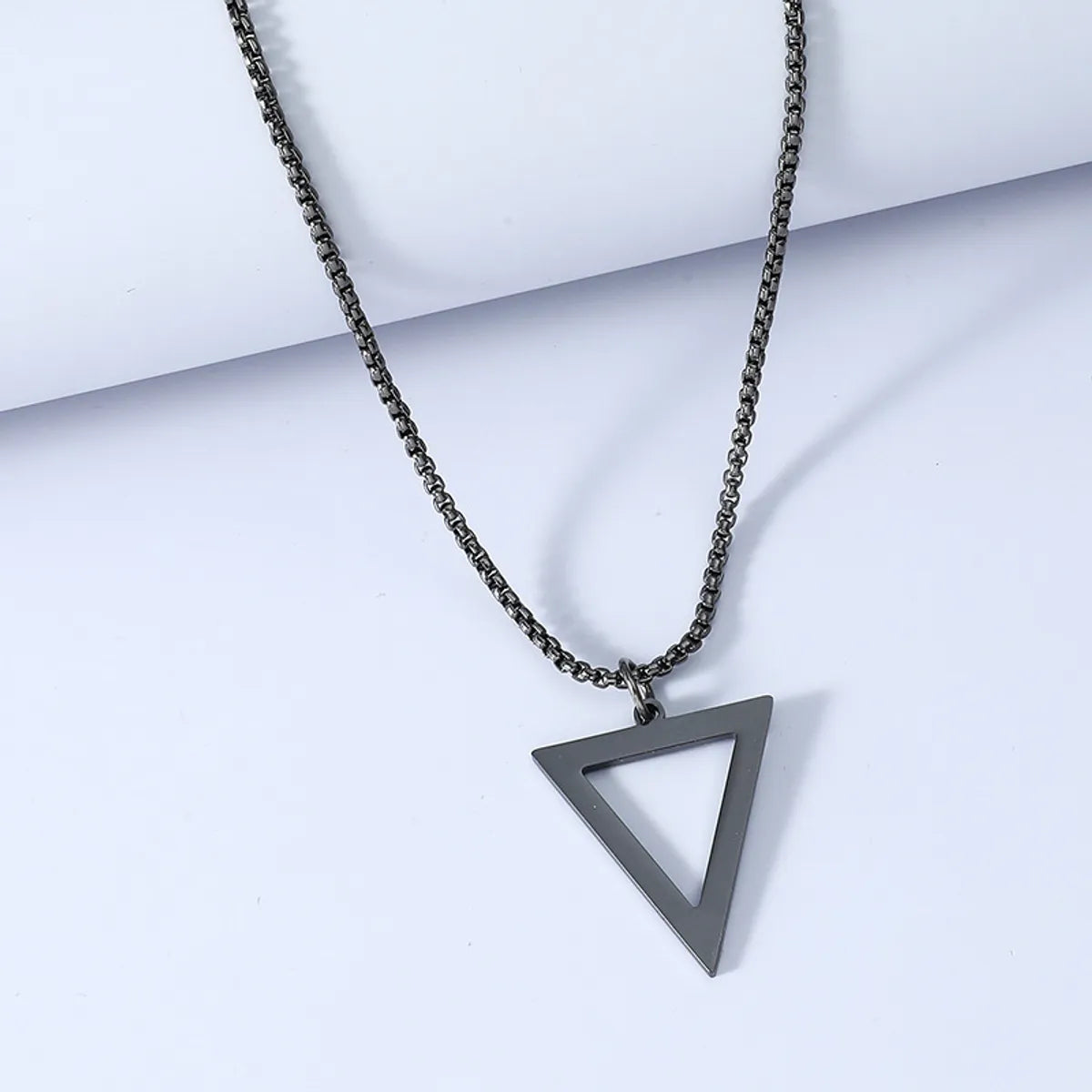 Best necklaces and pendants with opal and gold for a vibrant, luxurious contrast-Simple Titanium Steel Black Triangle Necklace