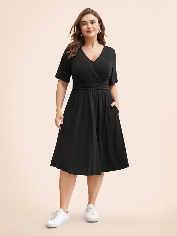 Plus size dresses featuring wrap styles are versatile -Flat sandals with arch support -Plus size dresses for graduations -Supersoft Essentials Solid Surplice Neck Ruched Front Dress