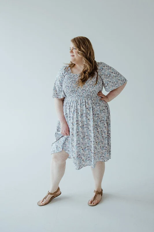 Plus size dresses with tie waists adjust perfectly -Colorful sandals for summer fun -Plus size dresses for sophisticated look -FLUTTER SLEEVE SMOCKED BODICE KNEE LENGTH DRESS IN COTTON CANDY