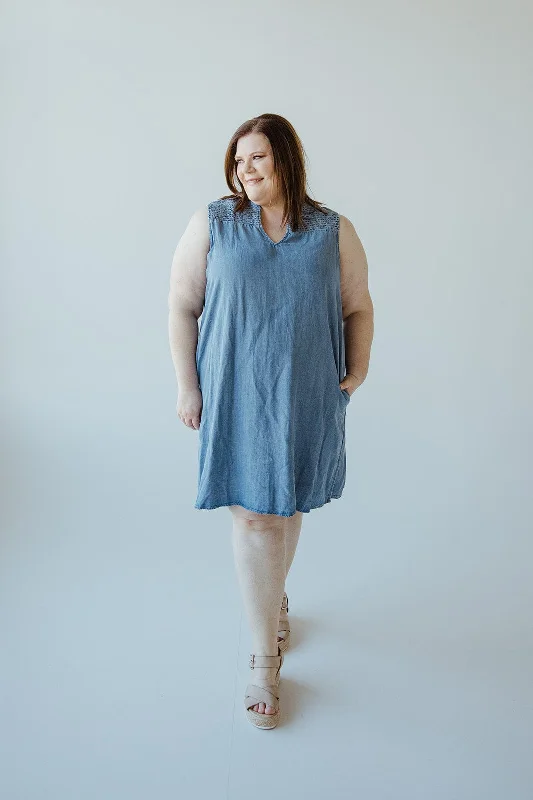 Plus size dresses with asymmetrical hems look modern -Sandals with buckle closures -Plus size dresses with tiered skirts -CHAMBRAY TANK DRESS WITH SMOCKED SHOULDERS